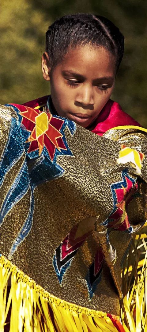 Young dancer in pow wow regalia