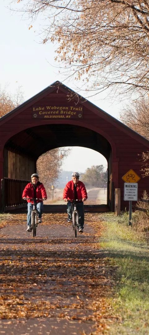 Couple biking Wobegon bike trail