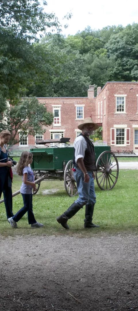 Family on a living history tour of Historic Forestville