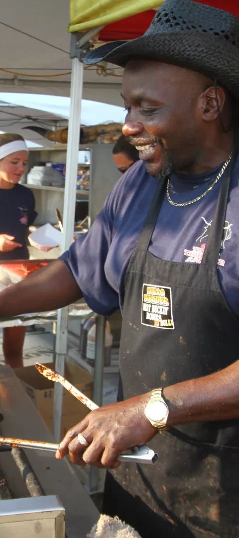 Man cooking ribs at Mankato Ribfest