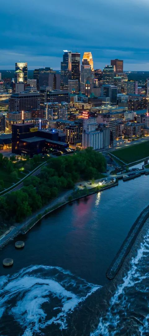 Minneapolis' skyline along the Mississippi River at night